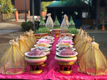 Multi colored candles on temple outside building