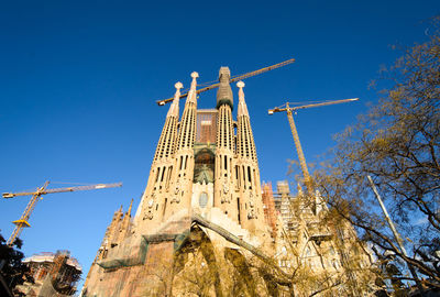 Low angle view of traditional building against clear blue sky