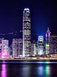 Illuminated buildings in city at night