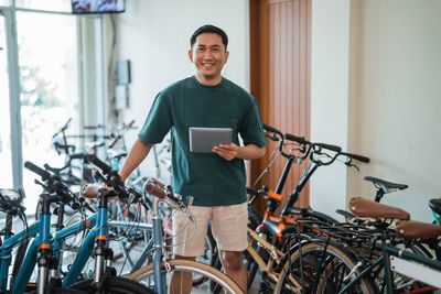 Side view of man riding bicycle