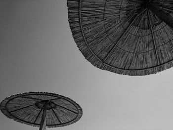 Low angle view of ferris wheel against sky