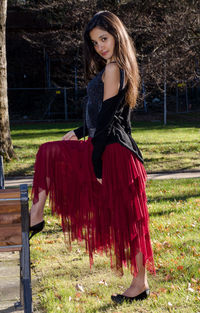 Portrait of woman wearing hat on field