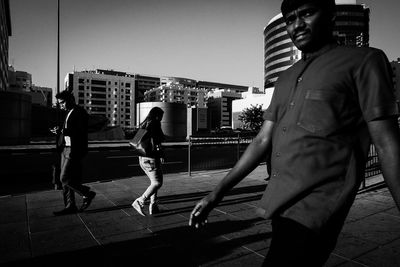 Woman standing on city street