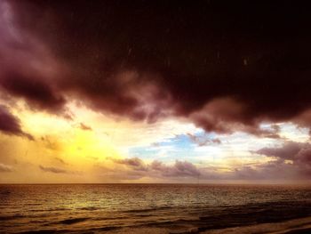 Scenic view of sea against dramatic sky