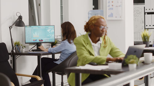 Business colleagues working in office