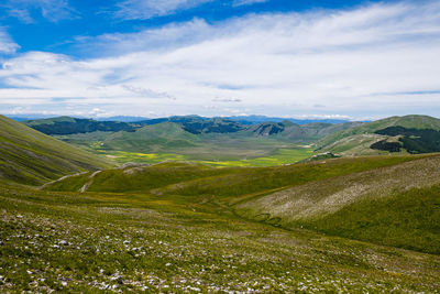 Scenic view of landscape against sky in castelluccio, umbria 