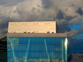Low angle view of building against cloudy sky