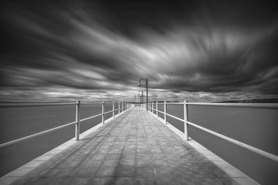 Pier over sea against sky