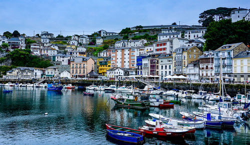Boats moored at harbor