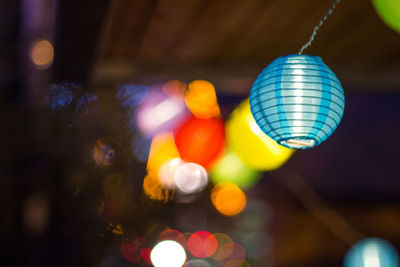 Low angle view of illuminated lights in city