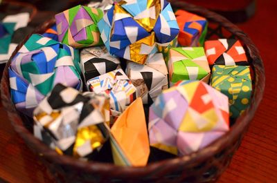Close-up of multi colored origami in basket