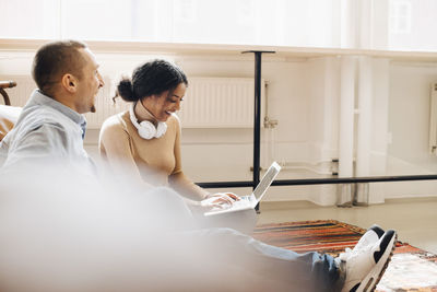 Cheerful programmers working in office