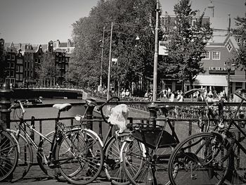 Bicycles in city against sky