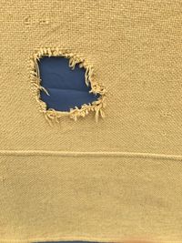 High angle view of hole on sand