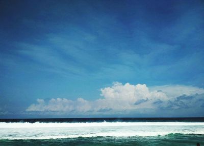 Scenic view of sea against blue sky