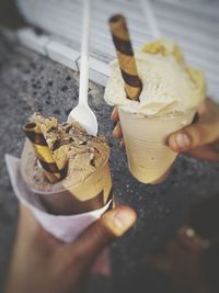 Close-up of hand holding ice cream