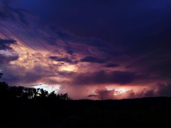 Scenic view of silhouette landscape against sky at sunset