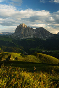 Scenic view of landscape and mountains against sky