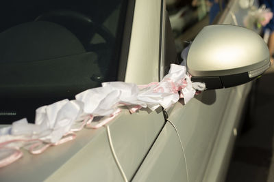 Close-up of white roses in car