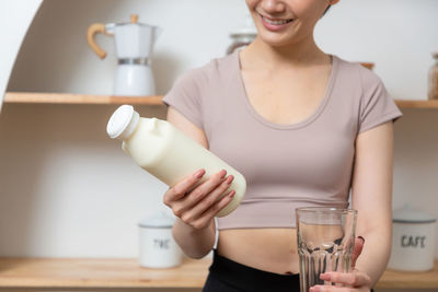 Young woman drinking glass