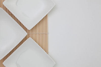 High angle view of white plate on table