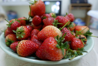 Close-up of strawberries in bowl on table