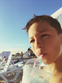 Close-up of boy having drink