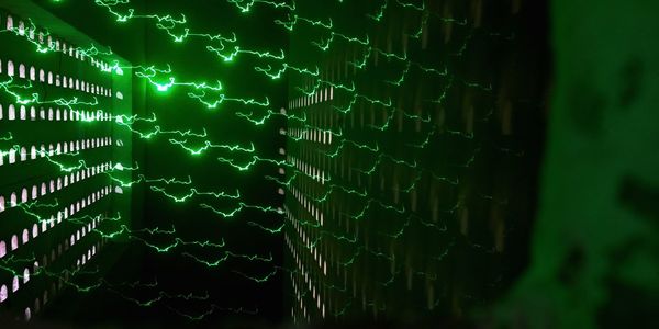 Full frame shot of illuminated lighting equipment on wall