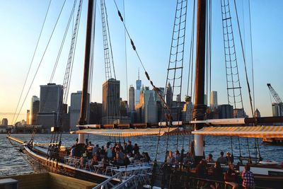 Panoramic view of suspension bridge in city against clear sky