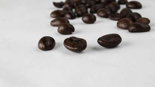 Close-up of coffee beans on table