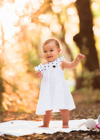 Portrait of cute girl standing outdoors