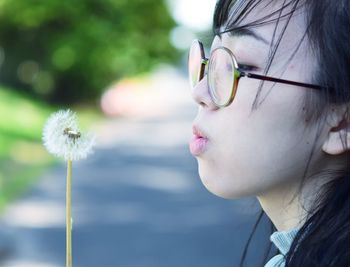 Close-up of young woman looking down