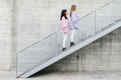 Women walking on staircase