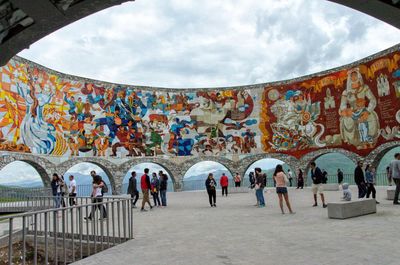Group of people walking in front of building