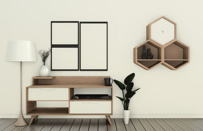 Chair on table against white wall at home