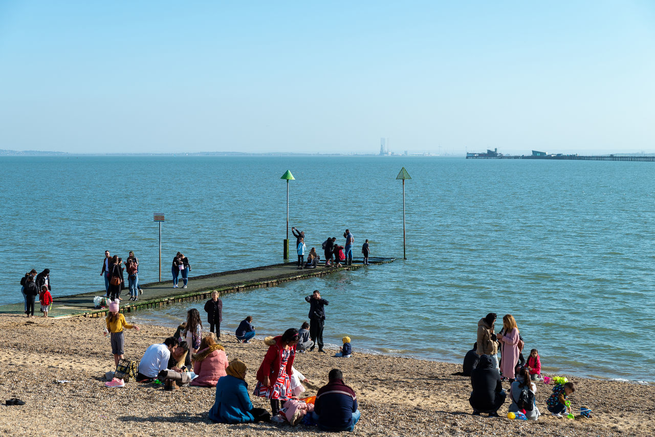 GROUP OF PEOPLE ON BEACH