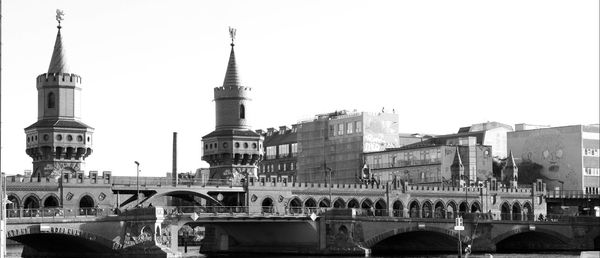 View of clock tower with buildings in background