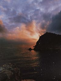 Scenic view of sea against sky at sunset