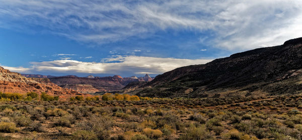 Scenic view of mountains against cloudy sky