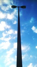Low angle view of telephone pole against sky