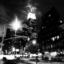 Low angle view of modern building against sky at night