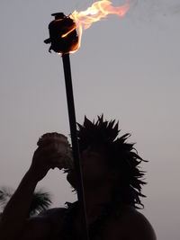 Low angle view of man against sky