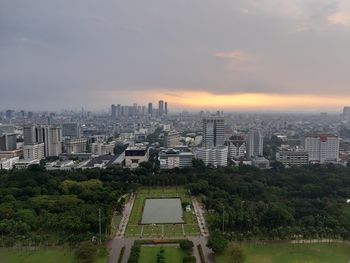 High angle view of buildings against sky during sunset