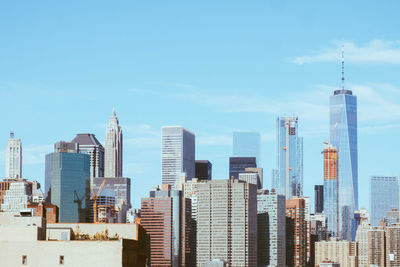 Modern buildings in city against sky