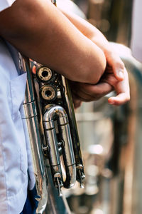 Close-up of man playing guitar