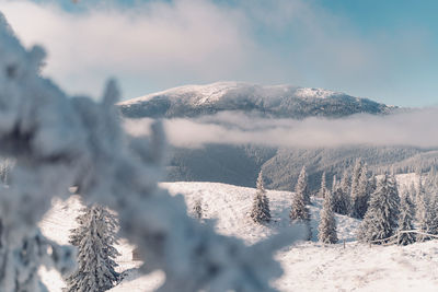 Scenic view of snowcapped mountains against sky