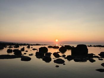 Scenic view of sunset over sea