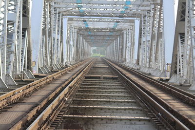 Railway tracks along bridge