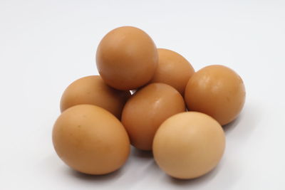 Close-up of oranges against white background