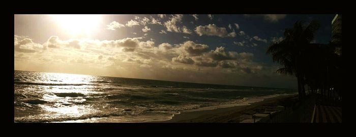 Scenic view of beach against sky during sunset